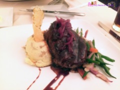 The charred filet of beef with mashed potatoes and veggies